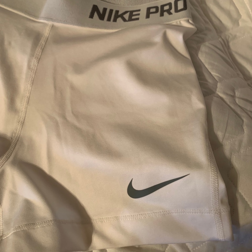 White and grey Nike pro shorts.